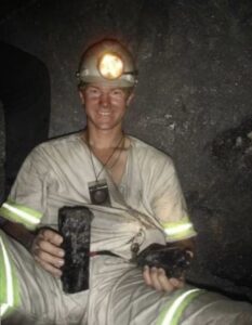 A profile photo of Dr. Robert Gessner working in a mine, likely in East Africa.