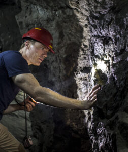 Bruce Bridges examining reef in Bonananza Tunnel, Scorpion Mine.